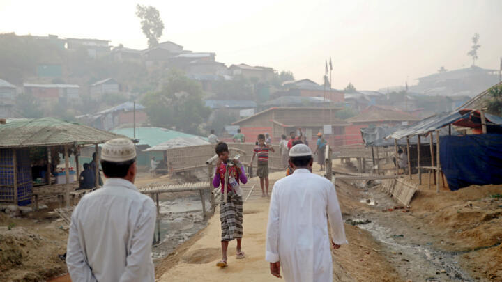 Rohingya refugees walk on a road at the Balukhali camp in Cox's Bazar, Bangladesh on April 8, 2019.